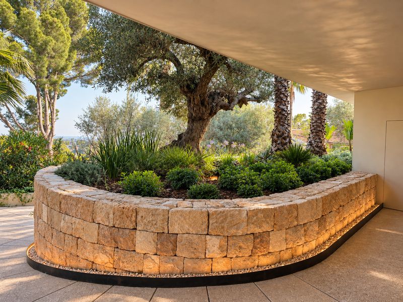 Stone planter beneath the porch